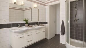 Un baño moderno con dos lavamanos, un espejo grande, ducha y una planta en maceta.