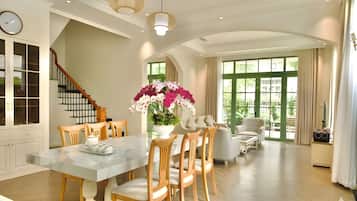 Deluxe Villa, 4 Bedrooms | Living area | 43-inch flat-screen TV with cable channels