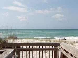 A wooden deck overlooking a beach with waves, sandy dunes, and a clear sky. -  Dragonfly Nest Upscale Home Pensacola Beach 9 miles, Public Golf course 1 mile (Pensacola)