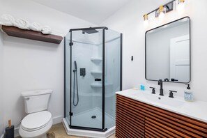 Shower, towels, soap, toilet paper