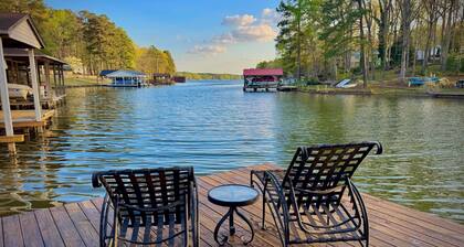 8 bdrm covered dock, bar and kitchen on the water! hot tub, firepit, sleeps 26,