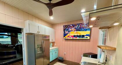 8 bdrm covered dock, bar and kitchen on the water! hot tub, firepit, sleeps 26,