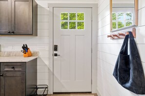A white door with a window, a knife block, and a hanging bag. - Secluded Cabin, Panoramic Views, Hot Tub, 2 King Beds (Sevierville)