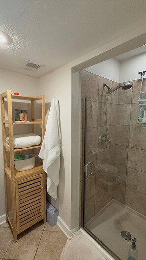 Shower, hair dryer, towels, soap