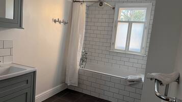 Shower, towels, soap, toilet paper