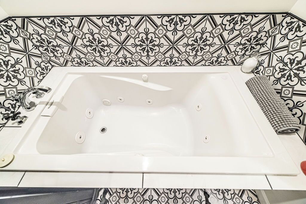 Jetted tub, hair dryer, towels, soap