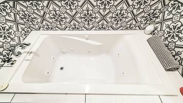Jetted tub, hair dryer, towels, soap