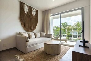 TV, offices - Modern 2BR Condo: Pool View, Kitchen & WiFi (Playa del Carmen)