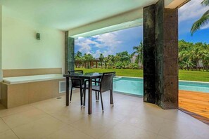 Outdoor dining - Beachfront 3BR Condo, Resort Pool | Playa (Playa del Carmen)