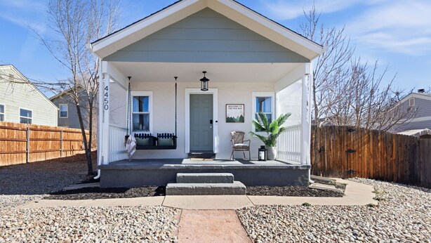 A single-story house with a front porch, a mailbox, and a welcome sign. - Family Arcade Home Pets OK Near Red Rocks (Englewood)