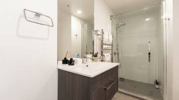 Shower, hair dryer, towels, soap