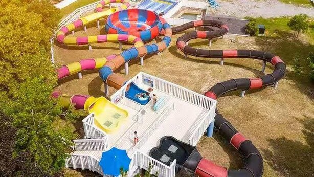 A water park with multiple slides and a lazy river. - Sun Retreats Sherkston Shores (Port Colborne)