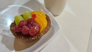A dessert on a white plate with a cup of coffee beside it. - Hotel y restaurante pura vida (Antigua Guatemala)