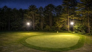 A nighttime golf course with well-lit areas and a flag on the green. - Saratoga Vineyard + Private Golf Course + Tavern - Sleeps 25 (Greenwich)