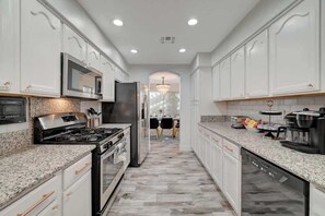 Fridge, microwave, oven, stovetop - Modern 4BR Paradise with Pool and Arcade Fun! (North Las Vegas)