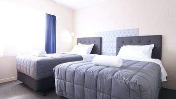Standaard appartement, meerdere bedden | Een bureau, gratis wifi, beddengoed
