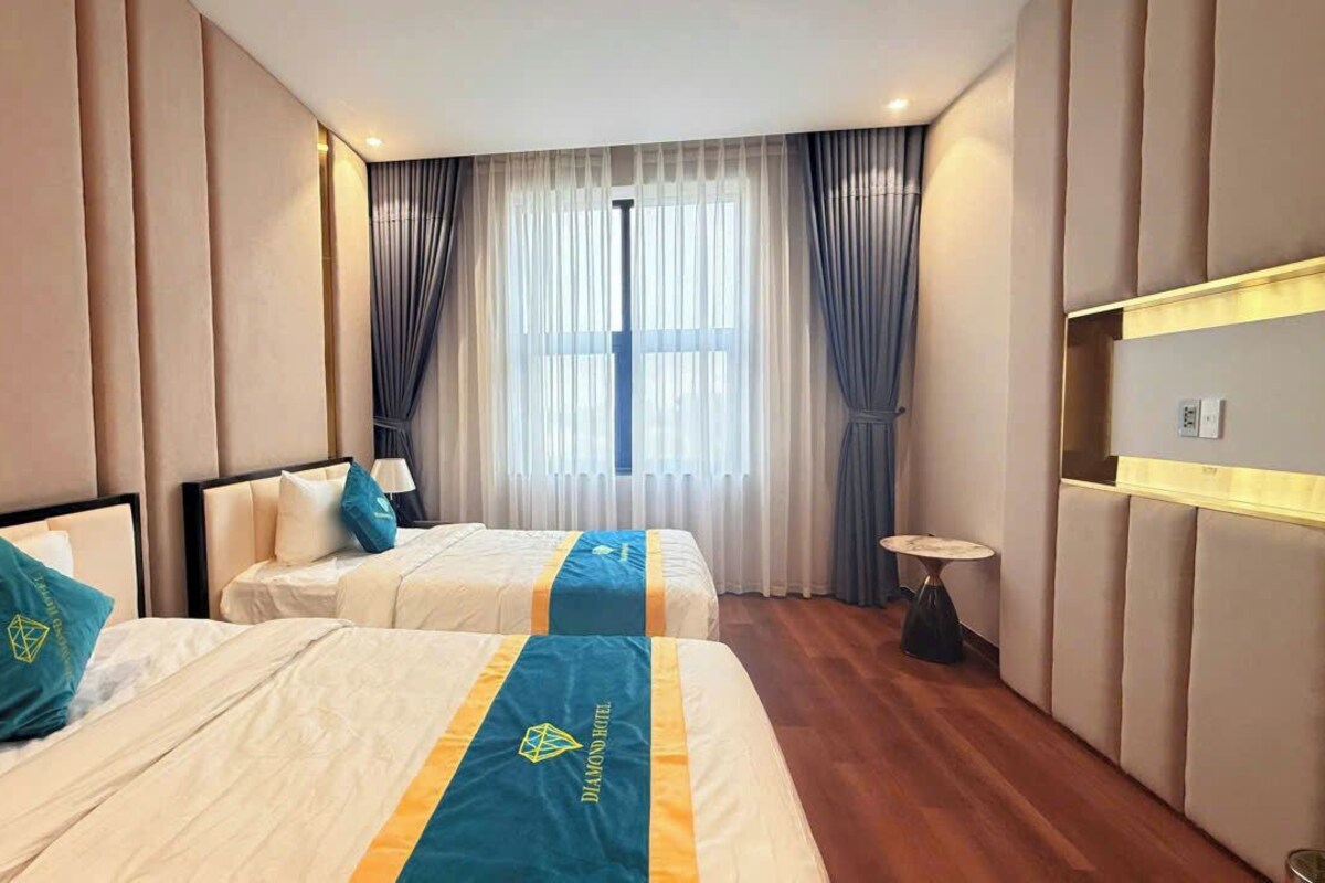 Deluxe Twin Room, Partial Lake View | In-room safe, laptop workspace, blackout drapes, iron/ironing board