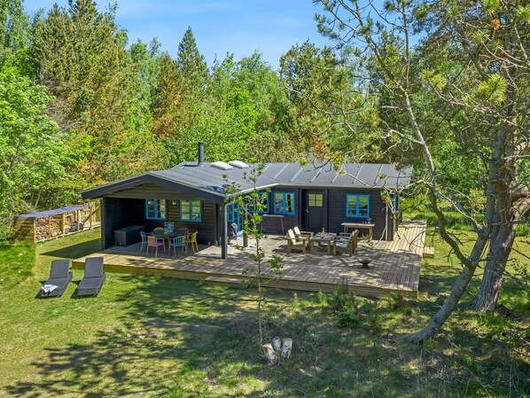 A cabin with a deck, outdoor seating, and a covered patio area. - "Aksinja" - 500m from the sea by Interhome (Jerup)