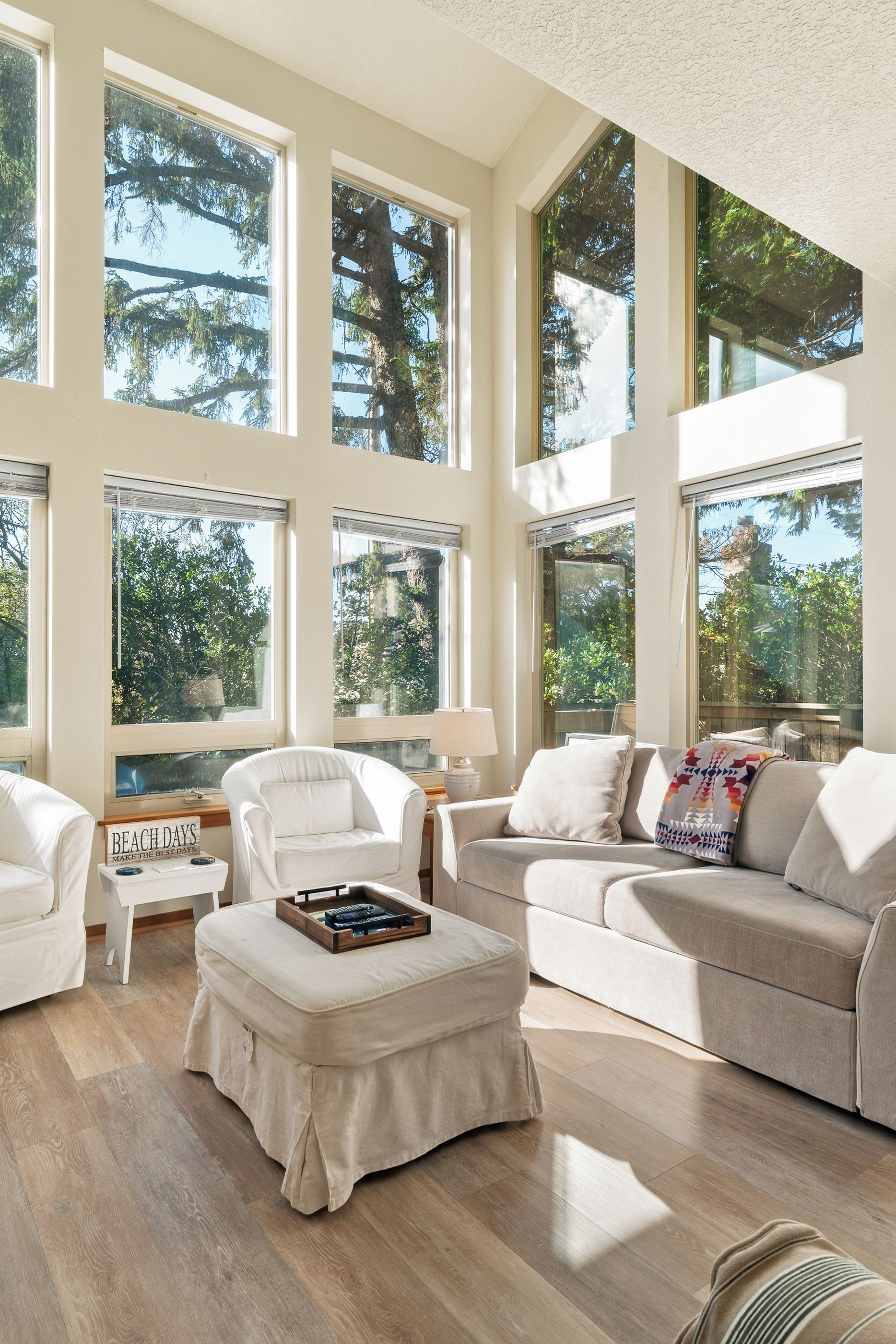 Living Room: Sun-soaked space with inviting seating and lush views—perfect for relaxation!
