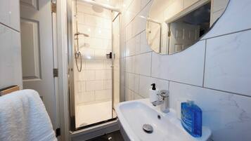 Shower, towels, soap, toilet paper