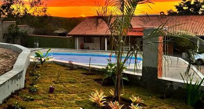 Cozy country house surrounded by nature, with a beautiful sunset view.