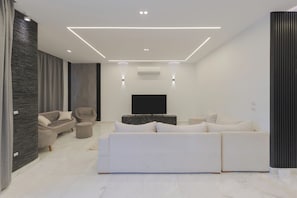 Luxury Villa, 6 Bedrooms, Private Pool, Garden View | Living area | 65-inch Smart TV with digital channels - Alsawah|Luxury 6BR Villa with Private Pool (Sheikh Zayed City)