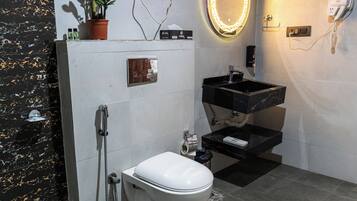 Luxury Room, Pool View | Bathroom | Shower, free toiletries, towels, toilet paper