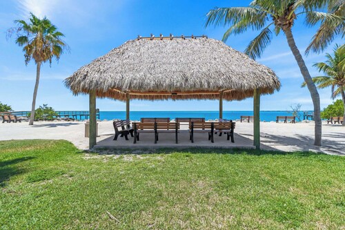 The perfect tropical sanctuary with turquoise waters and steps from the beach.