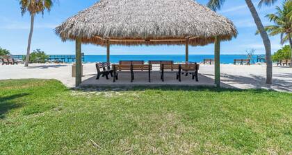 The perfect tropical sanctuary with turquoise waters and steps from the beach.