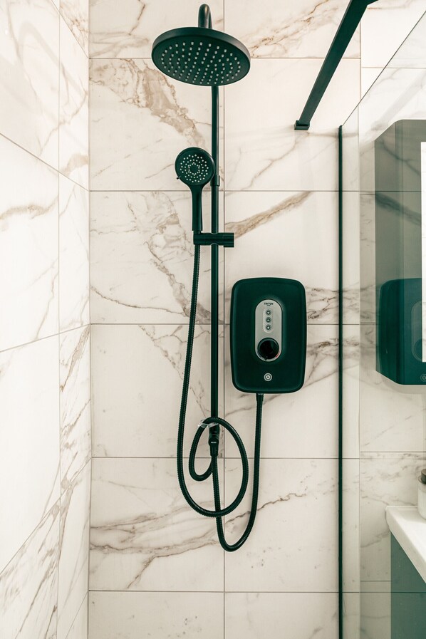 Shower, hair dryer, towels, soap