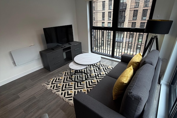 Superior Apartment, Balcony, City View | Living area | 55-inch Smart TV with digital channels