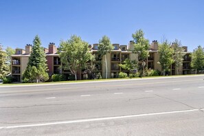 A multi-story building with a flat roof, several balconies, and a clear sky. - Park City Snowcrest Chalet (Park City)
