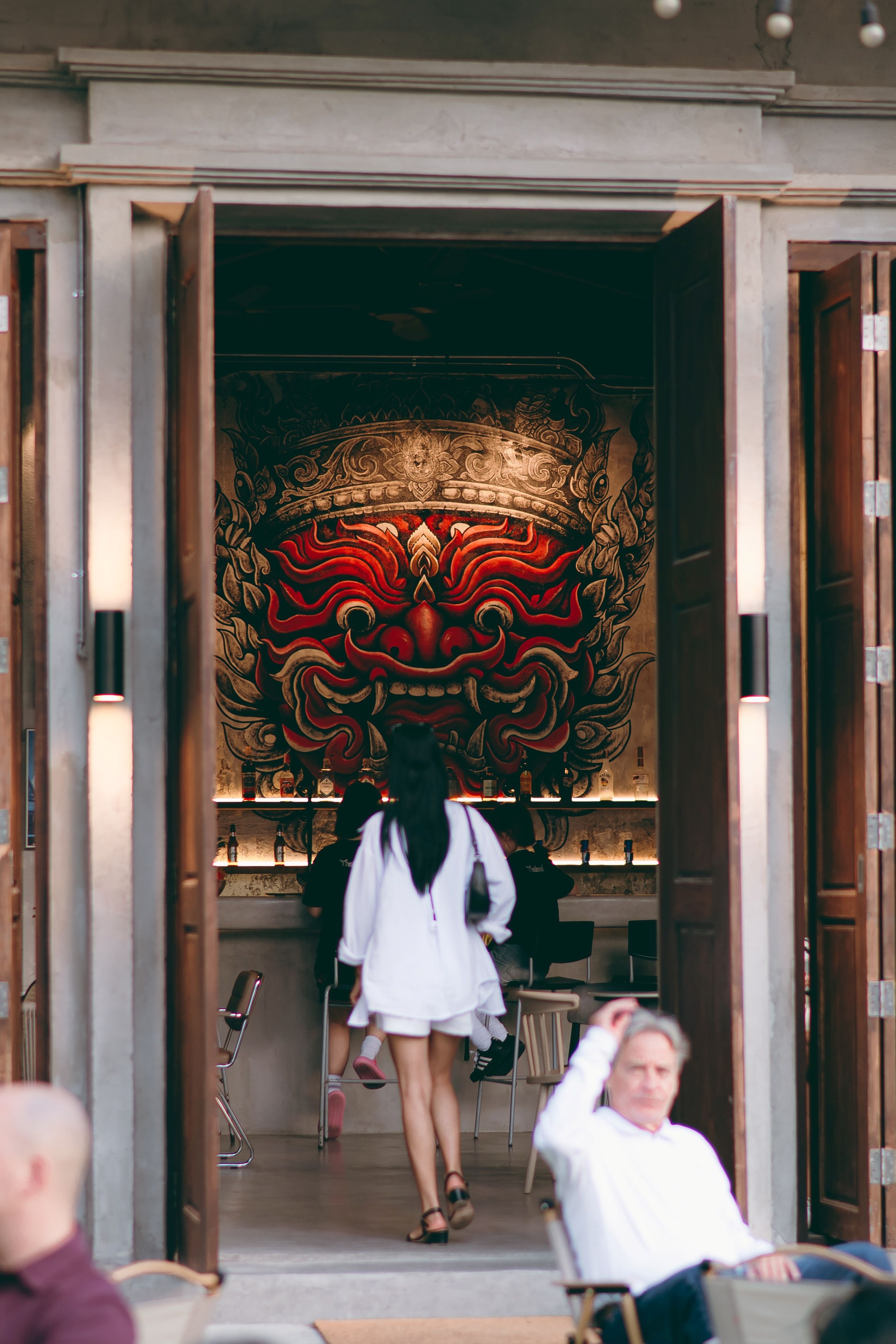 A building entrance with a large, ornate mural.