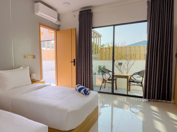 Quarto standard, sacada, vista para o jardim