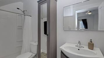 Shower, towels, soap, toilet paper
