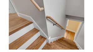 A wooden staircase with white walls and a small window at the top. - Sunday River Group Getaway (Bethel)