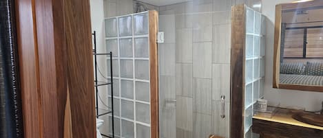 Shower, towels, soap, toilet paper