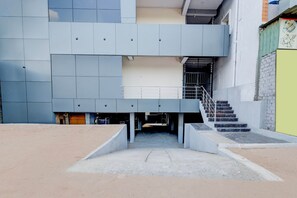 A multi-level building with a staircase leading to an upper floor. - Hotel O Injapur Lake (Hyderabad)