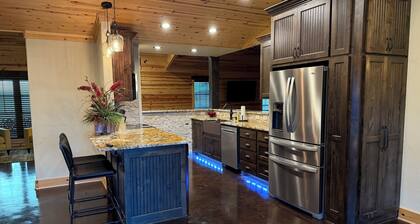 Cozy three-bedroom farmhouse with 2 full baths and large covered deck/hot tub.