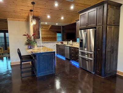 Cozy three-bedroom farmhouse with 2 full baths and large covered deck/hot tub.