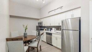 Fridge, dining tables - Landing | Modern 1BD in Downtown New Haven (New Haven)