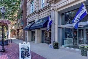 A building with 'The Liberty' signage, a brick facade, and large windows. - Landing | Beautiful Studio in Downtown New Haven (New Haven)