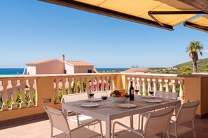 A table set for dining with a view of the sea and hills. - Villa Lamar - Three Bedroom Villa, Sleeps 6 (Alayor)