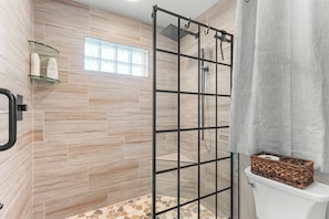 Shower, hair dryer, towels, toilet paper