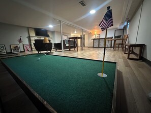 A pool table with an American flag, a lamp, and framed pictures on the wall. - Pool House- 4bd/ 2ba- in the city of Chicago (Chicago)