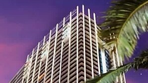 Un immeuble de grande hauteur doté d’une façade originale en zigzag et de balcons.