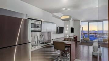 Fridge, microwave, stovetop, coffee/tea maker