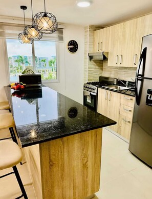 Private kitchen - Cozy 2BR Retreat w/ Pool, WiFi, Parking – Minutes to Beach (Punta Cana)