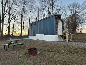 Outdoor dining - 1-bedroom cabin located at The Market & Drinkery. 11 miles North from NRG bridge (Mount Lookout)