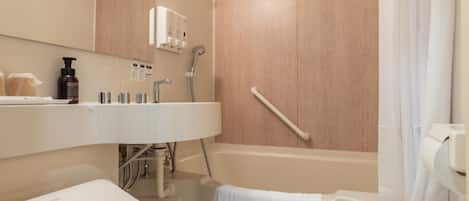 Combined shower/tub, free toiletries, hair dryer, slippers